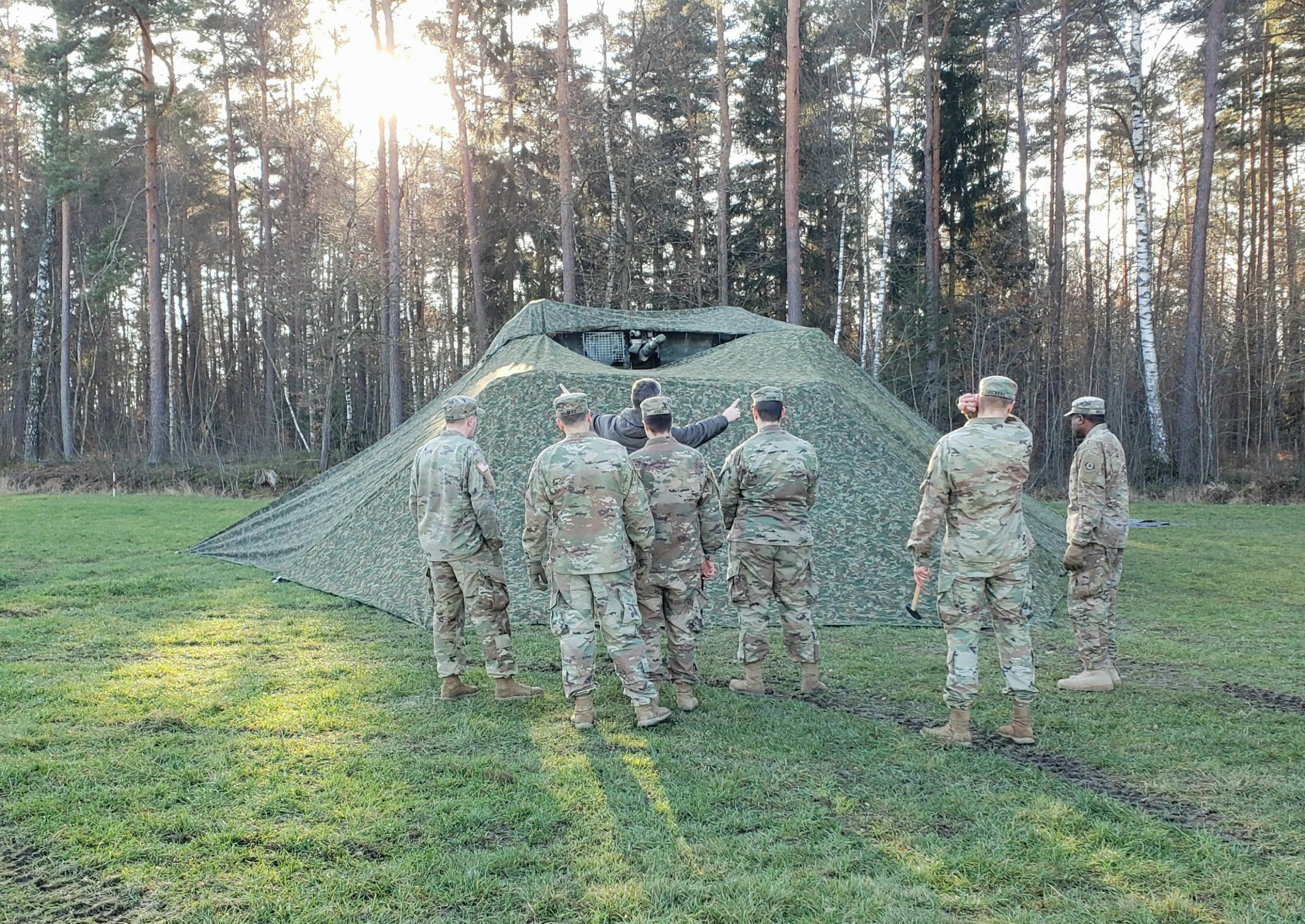 Soldiers with camo netting